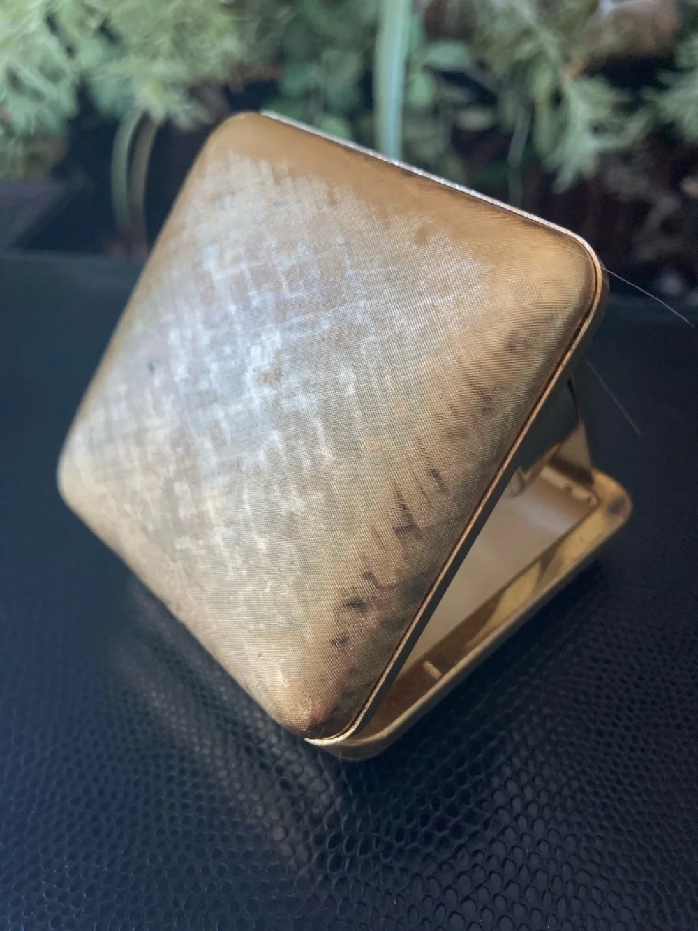 Classic mid-century Seth Thomas folding travel alarm clock in gold-tone texture